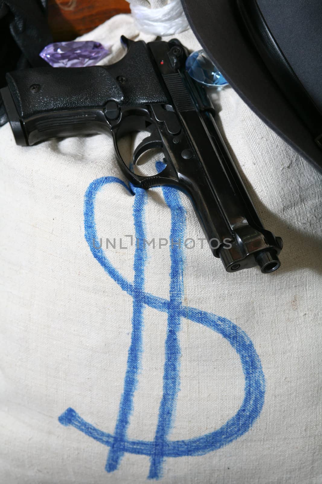 An image of a gun and a bag on a chair