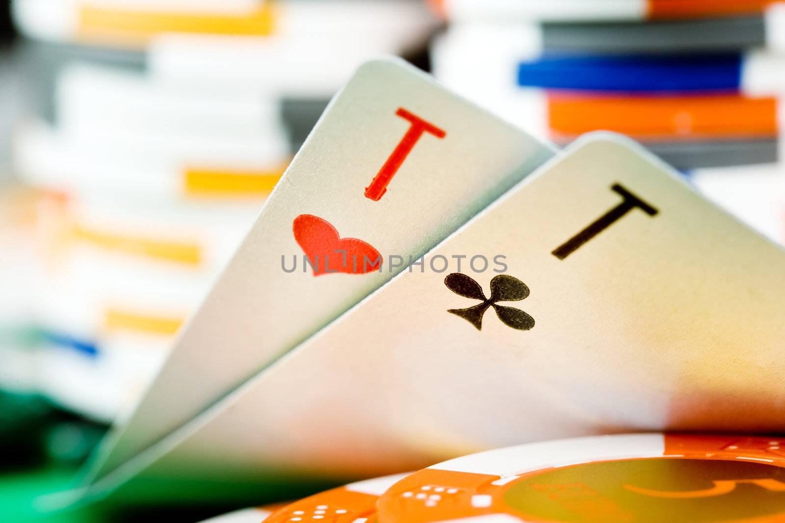 Two cards close-up and heap of chips