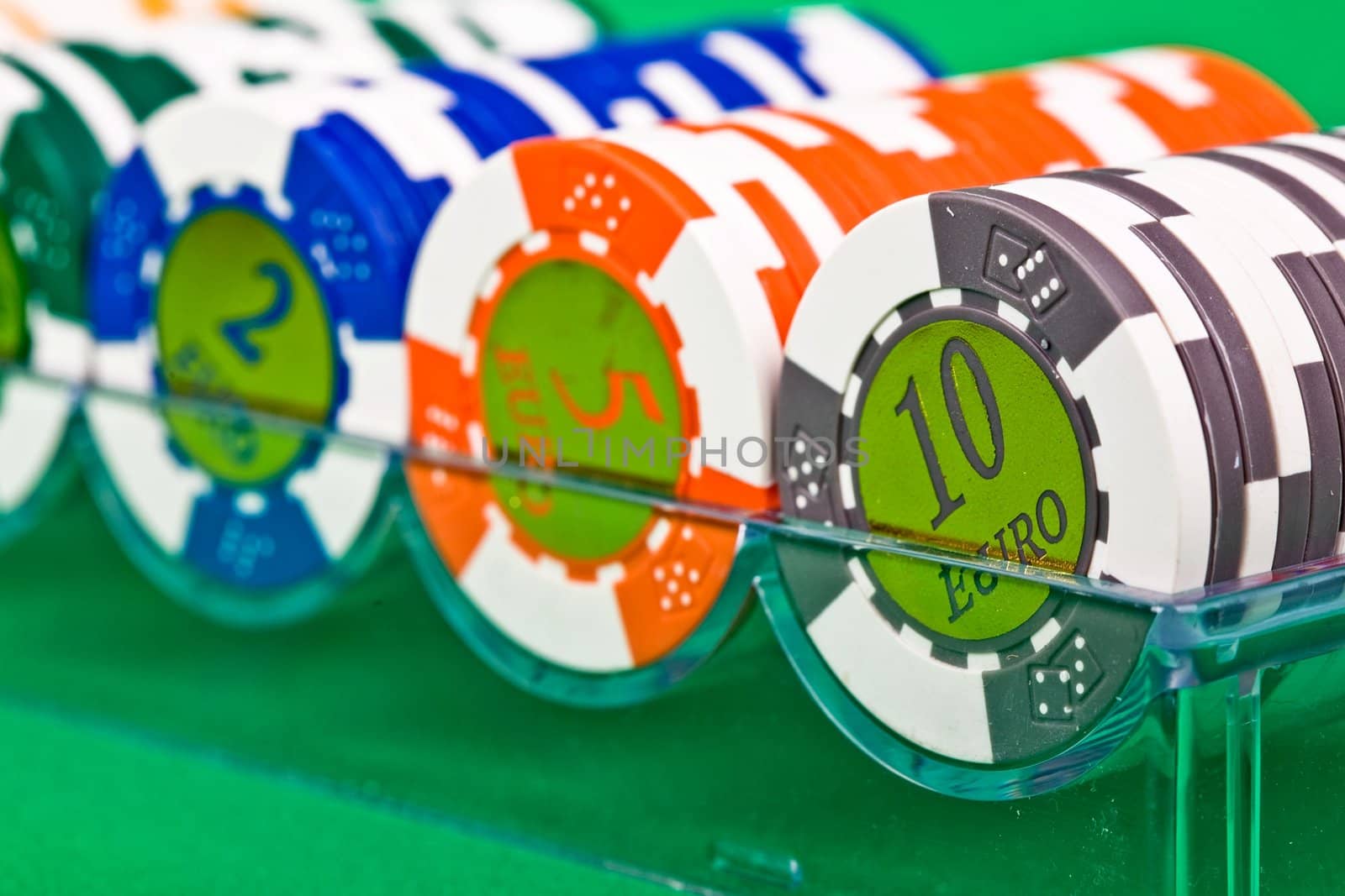 An image of poker chips in plastic box