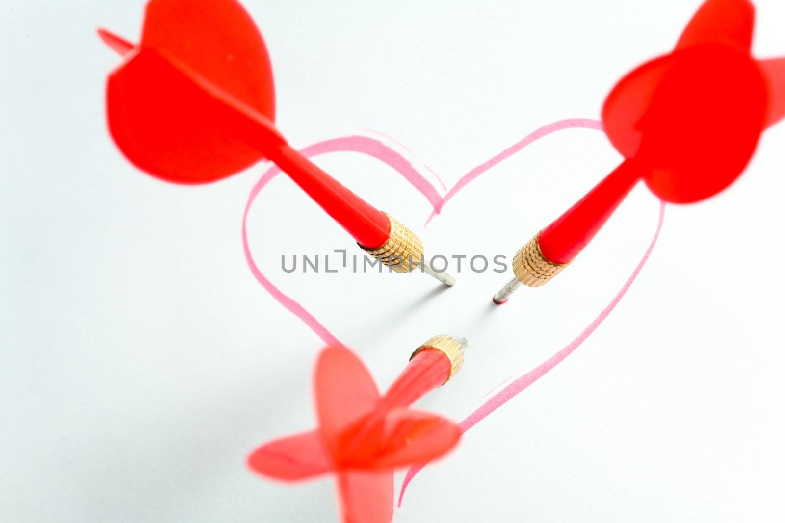 An image of red darts in heart