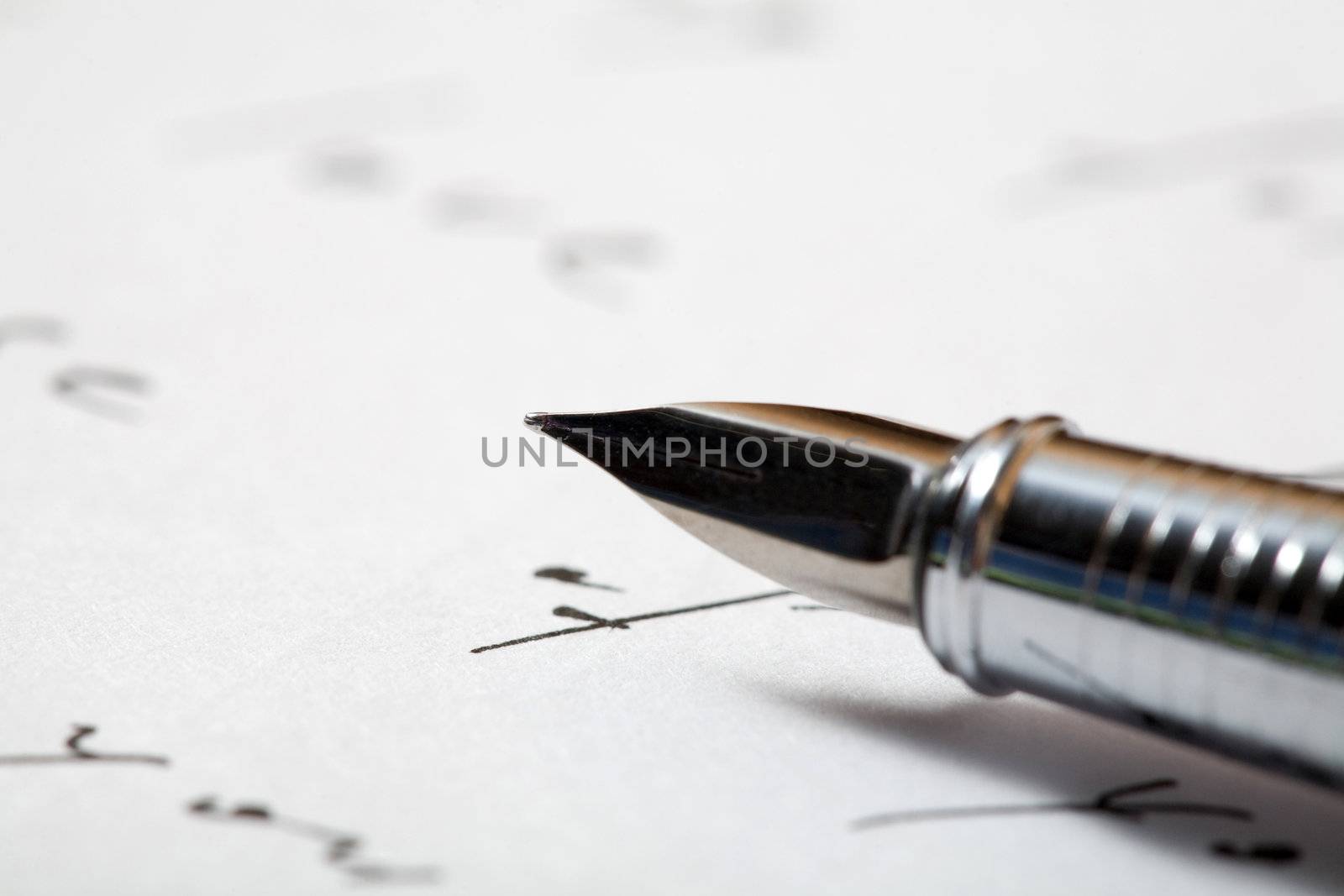 An image of a pen on a  background of a letter