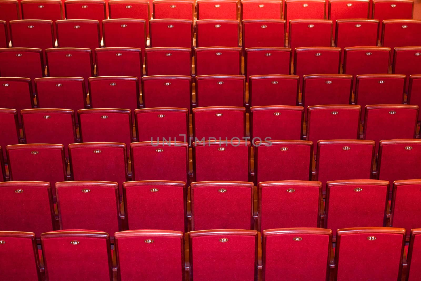 Stock photo: an image of many rows of red chairs