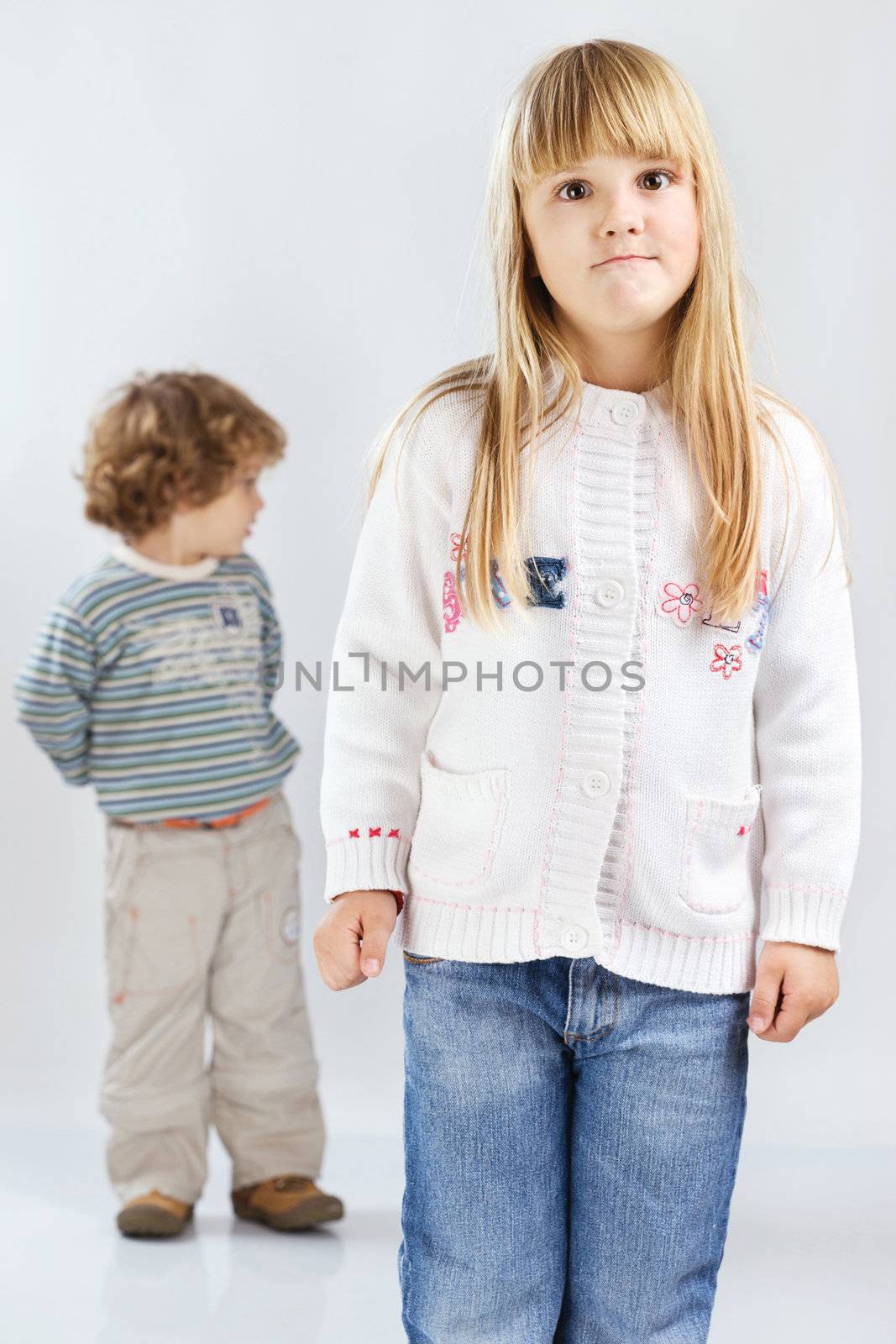 Two children, girl have face expression