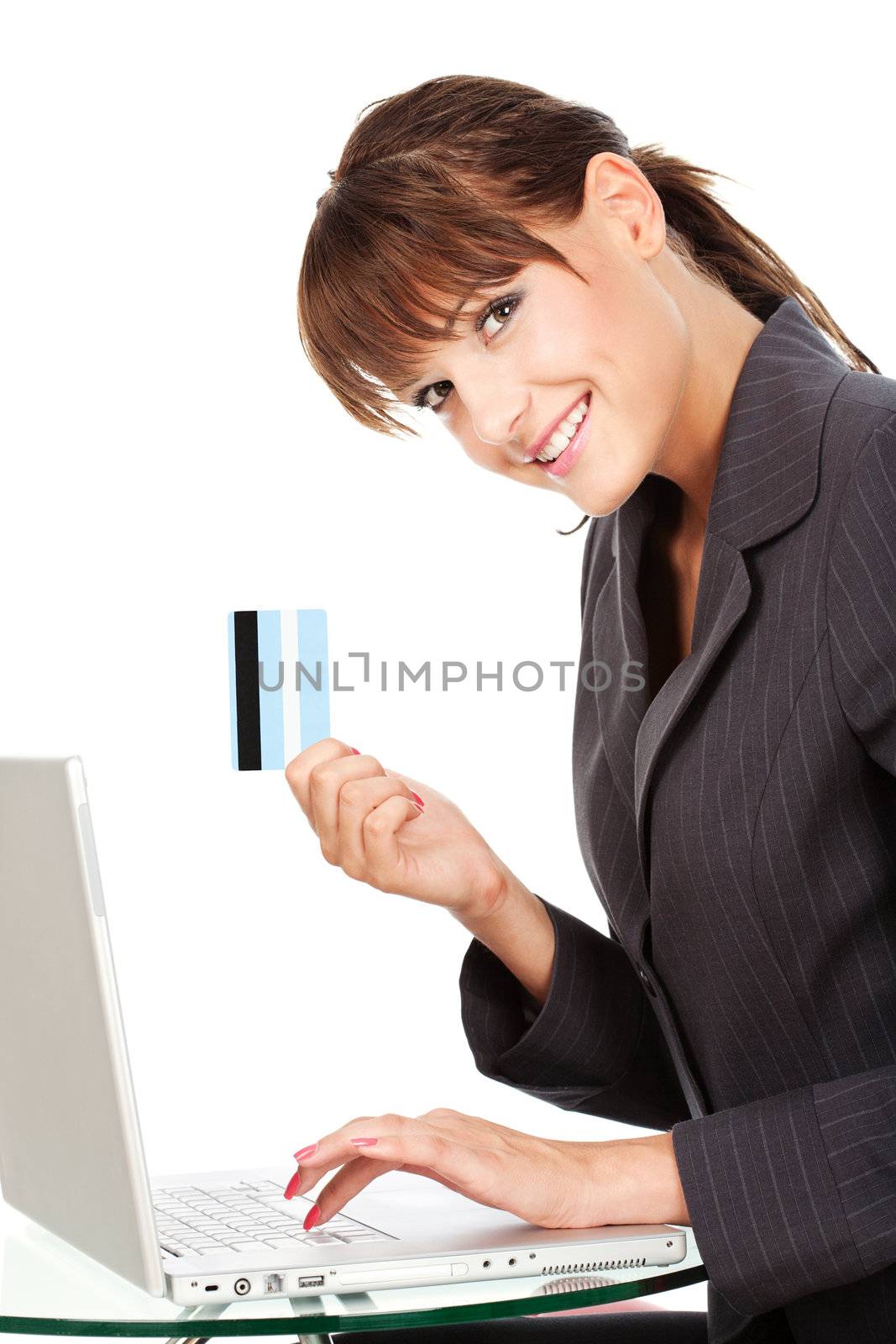 Businesswoman typing on keyboard and holding credit card, isolated on white background