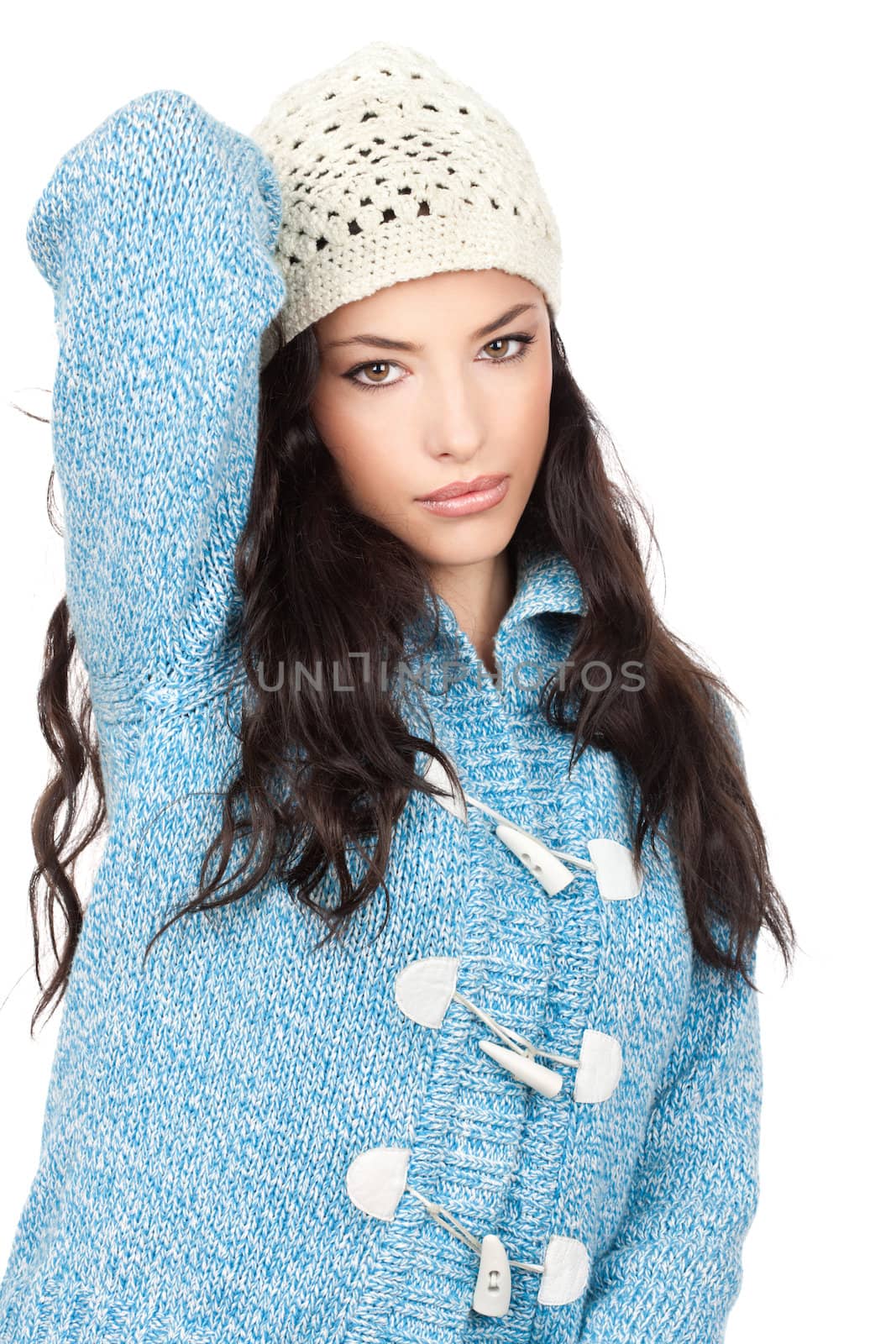 portrait of a young black hair woman in a blue wool sweater, isolated on white background