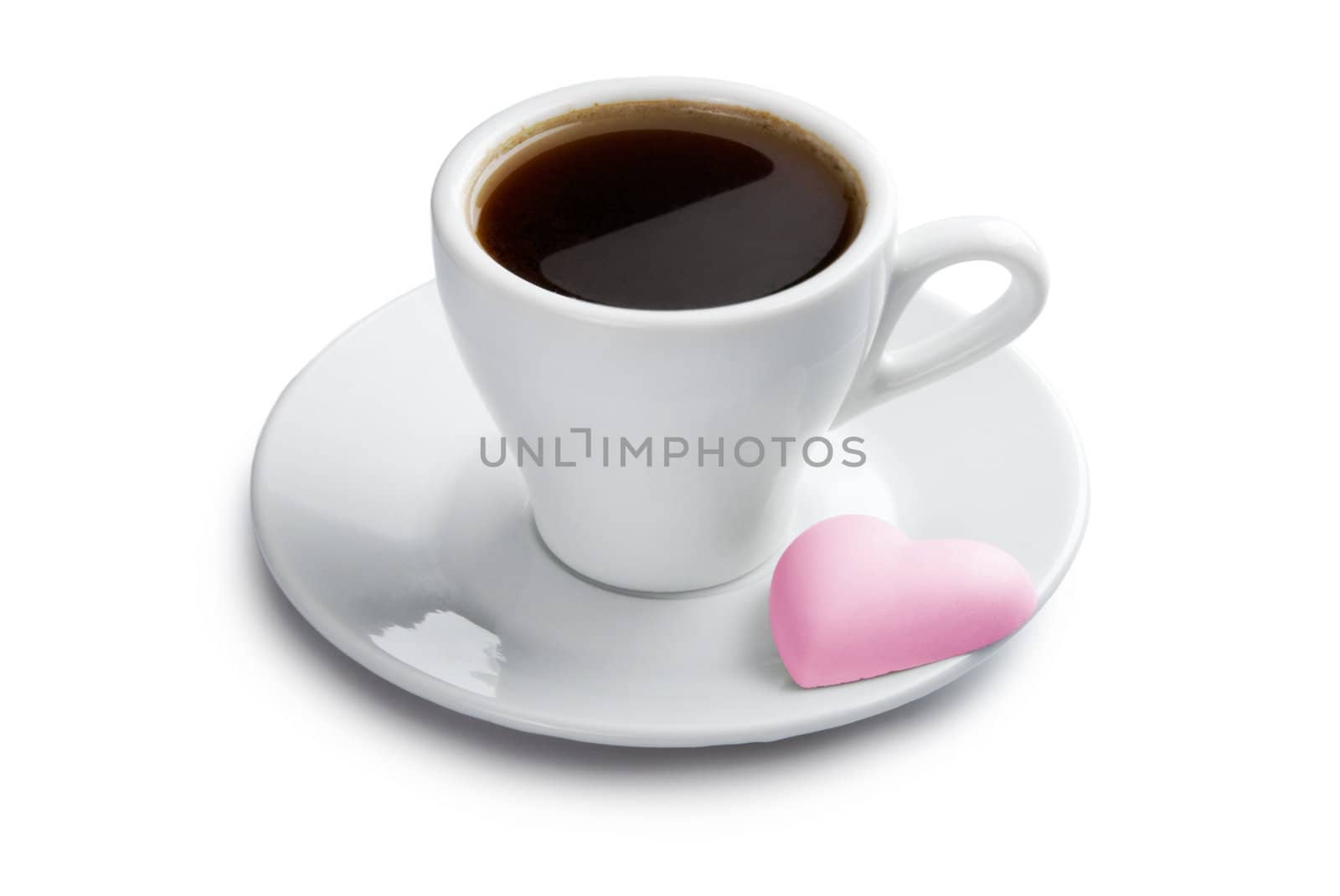 Cup of coffee with pink heart shape cookie. Isolated with clipping path on white background