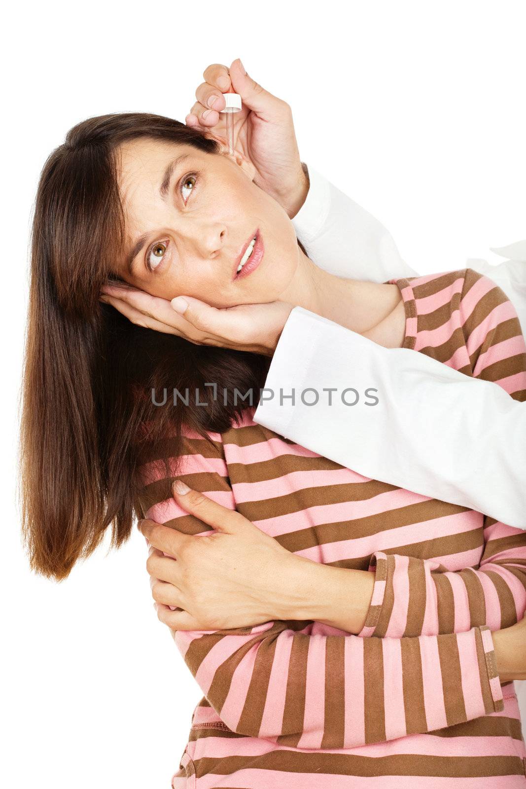 Doctor holding a eardropper over woman's ear, isolated on white