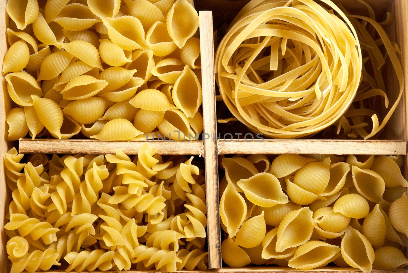 Set of four varieties of pasta in a wooden box