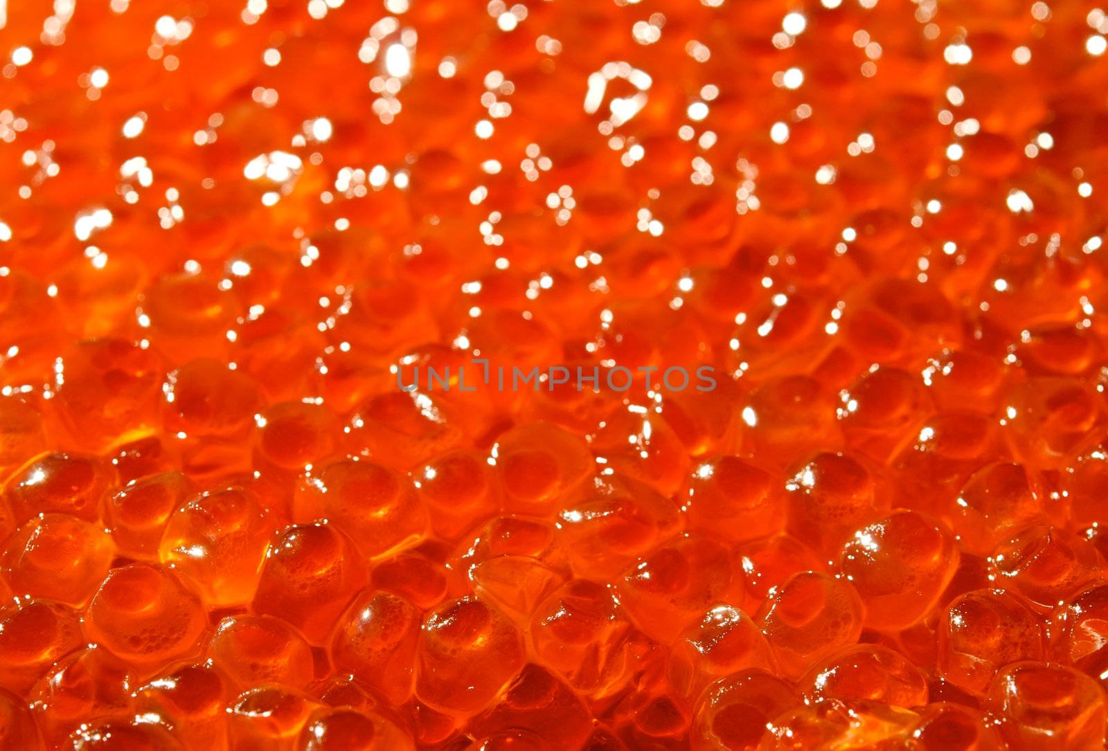Tasty delicious red soft caviar as background 