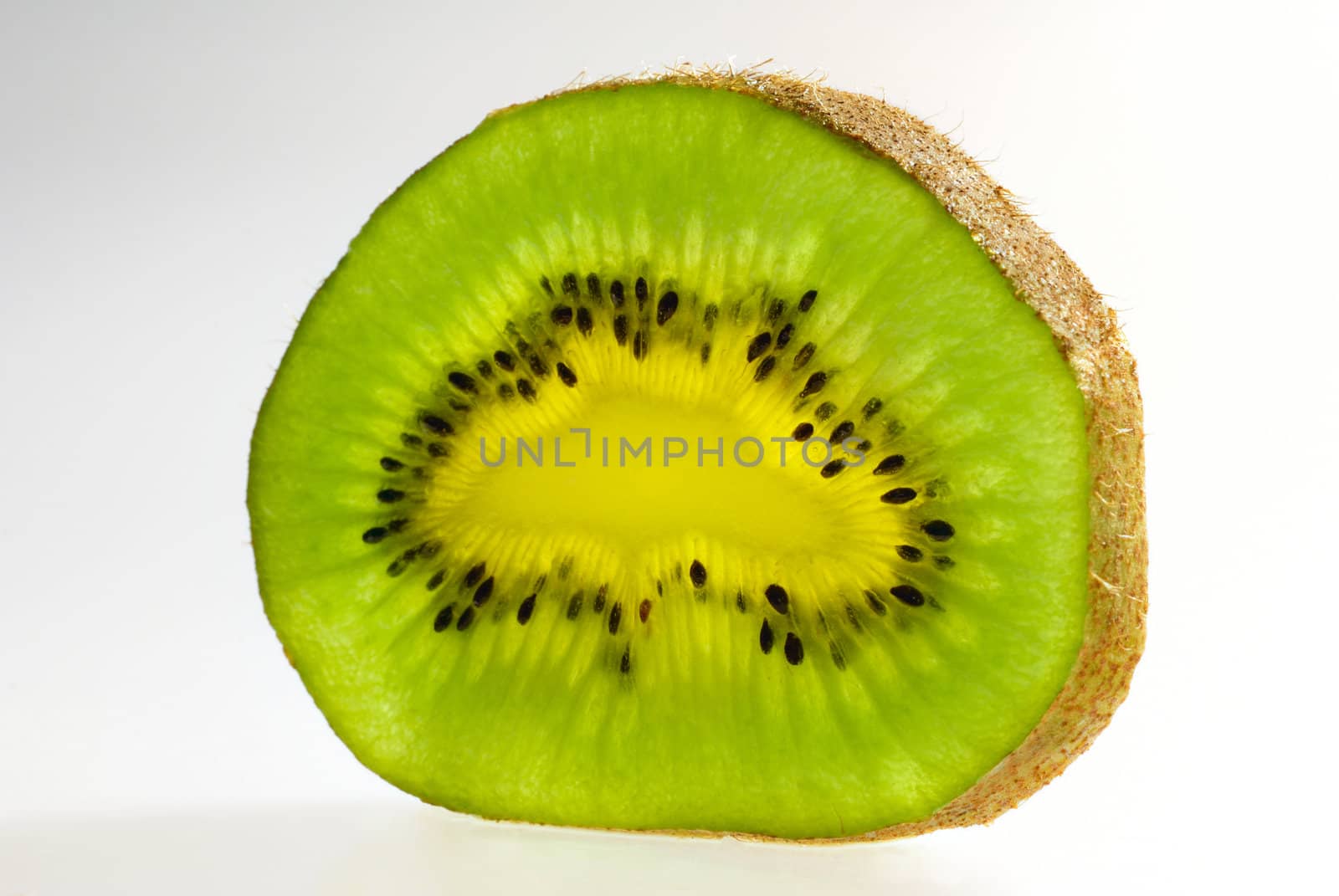 Close up of kiwi slice isolated over white background