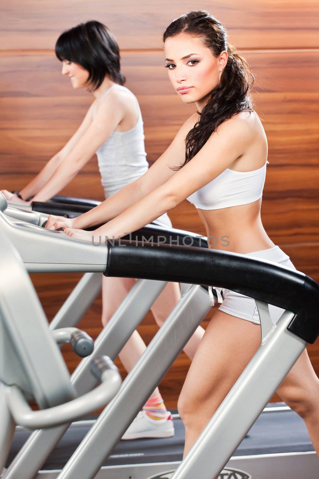 Women doing exercise in gym center