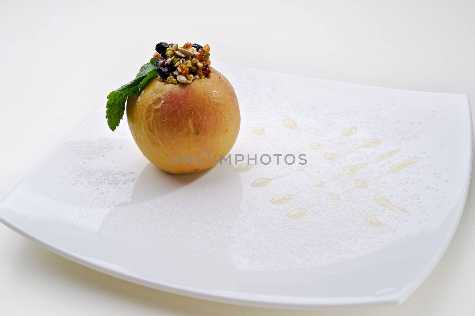 Foie gras with apple served on white plate