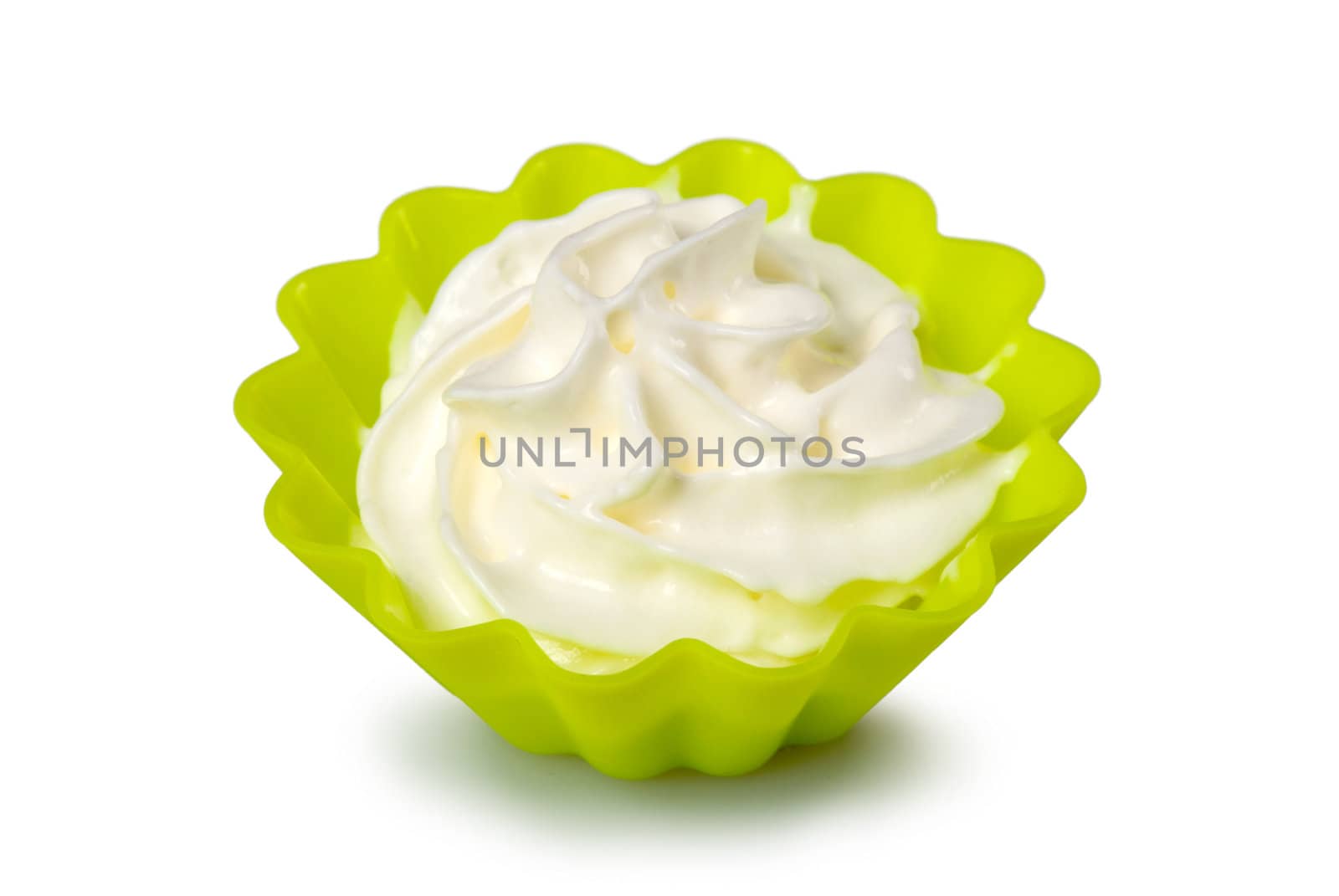 Portion of whipped cream over white background. Shallow DOF