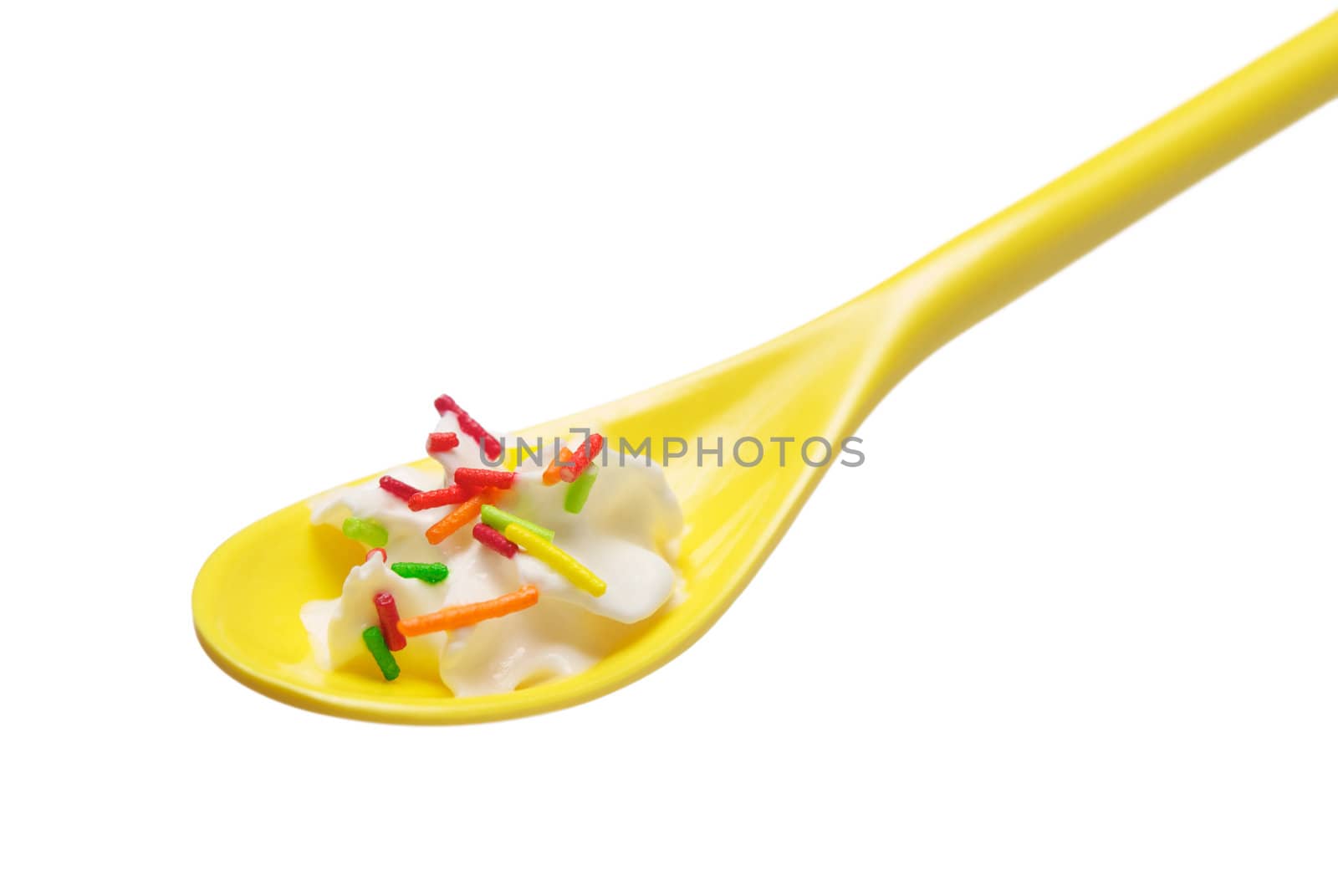 Teaspoon full of cream closeup, isolated on white background. With clipping path