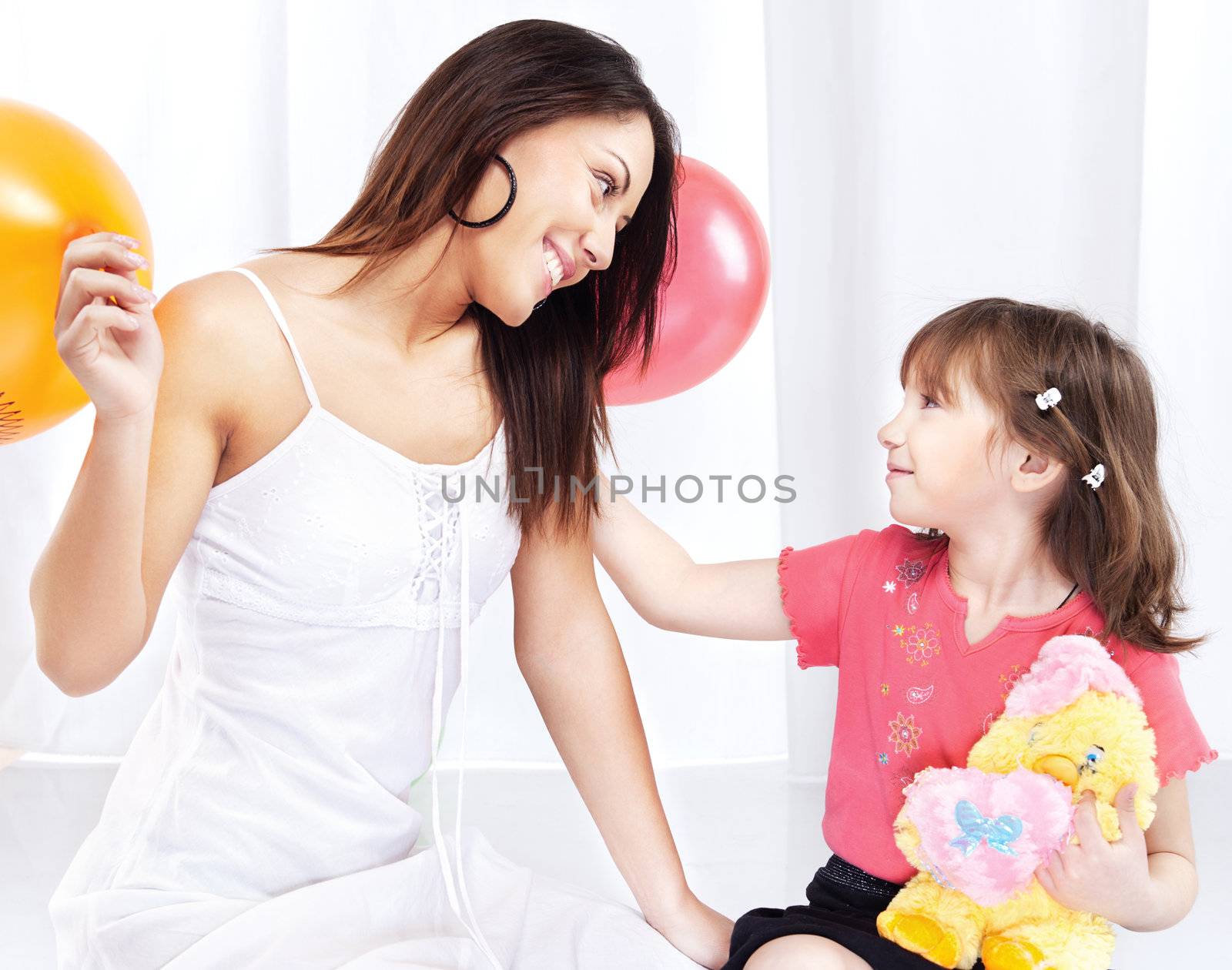Brunette woman and child playing