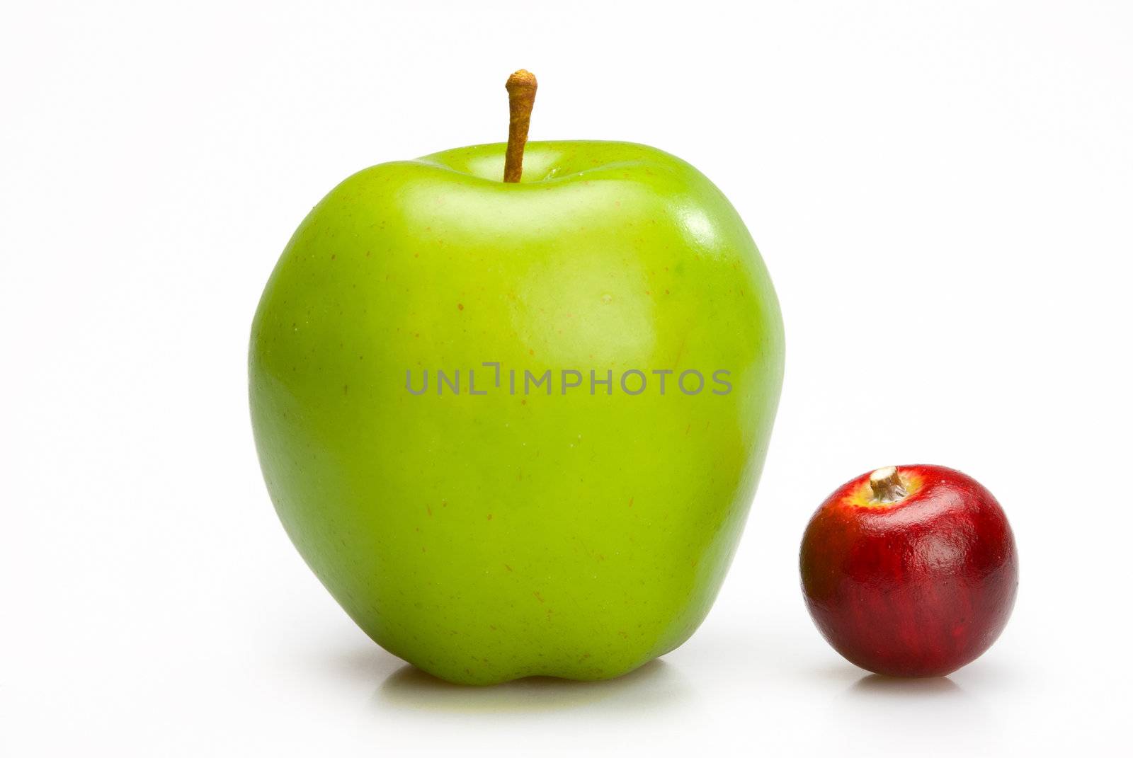 Big and small apples. Two ripe apples, red and green isolated on white background