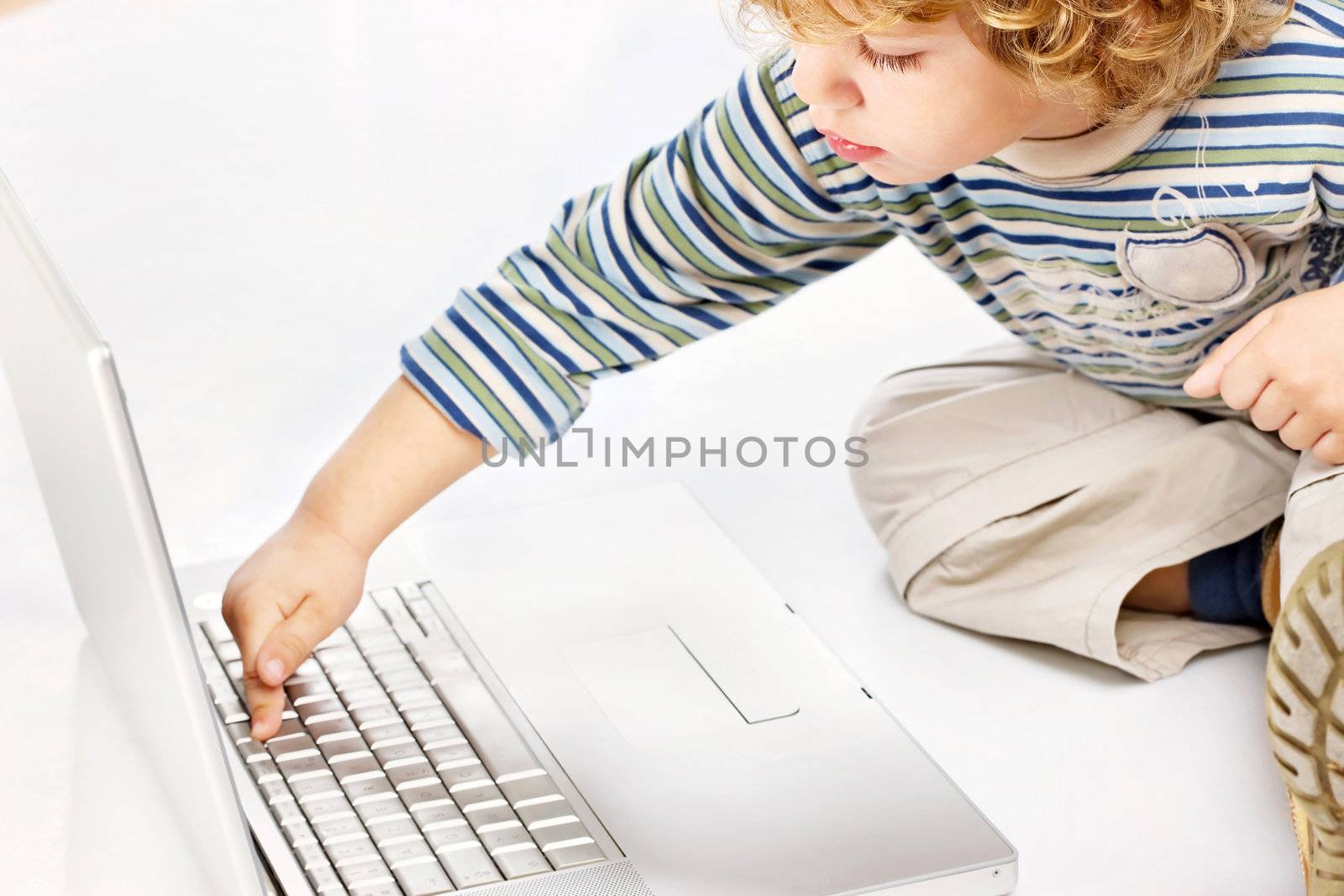 Blue hair boy exploring computer