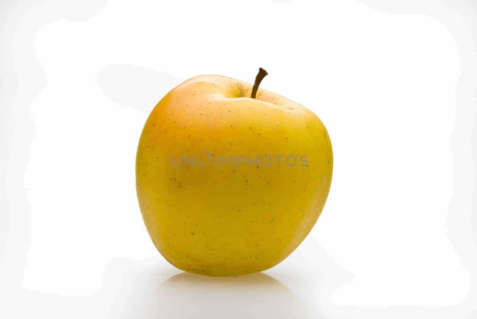 Yellow apple with graft on white background