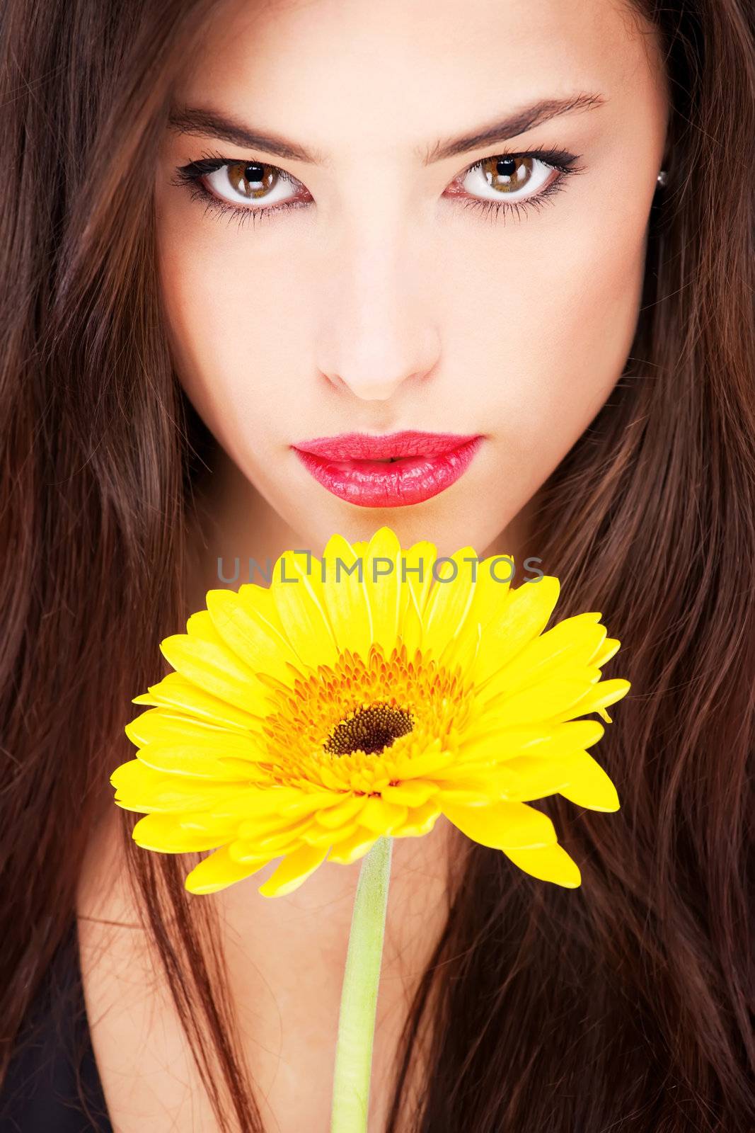 Pretty woman and yellow daisy