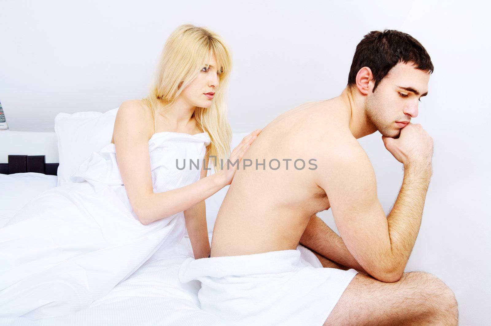 Young couple having problems in bedroom, focus on female