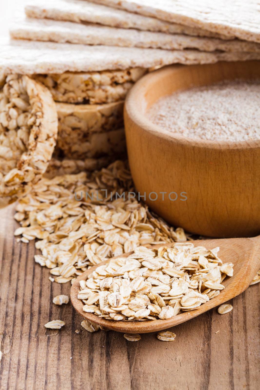 Various dietary oat products on wooden table