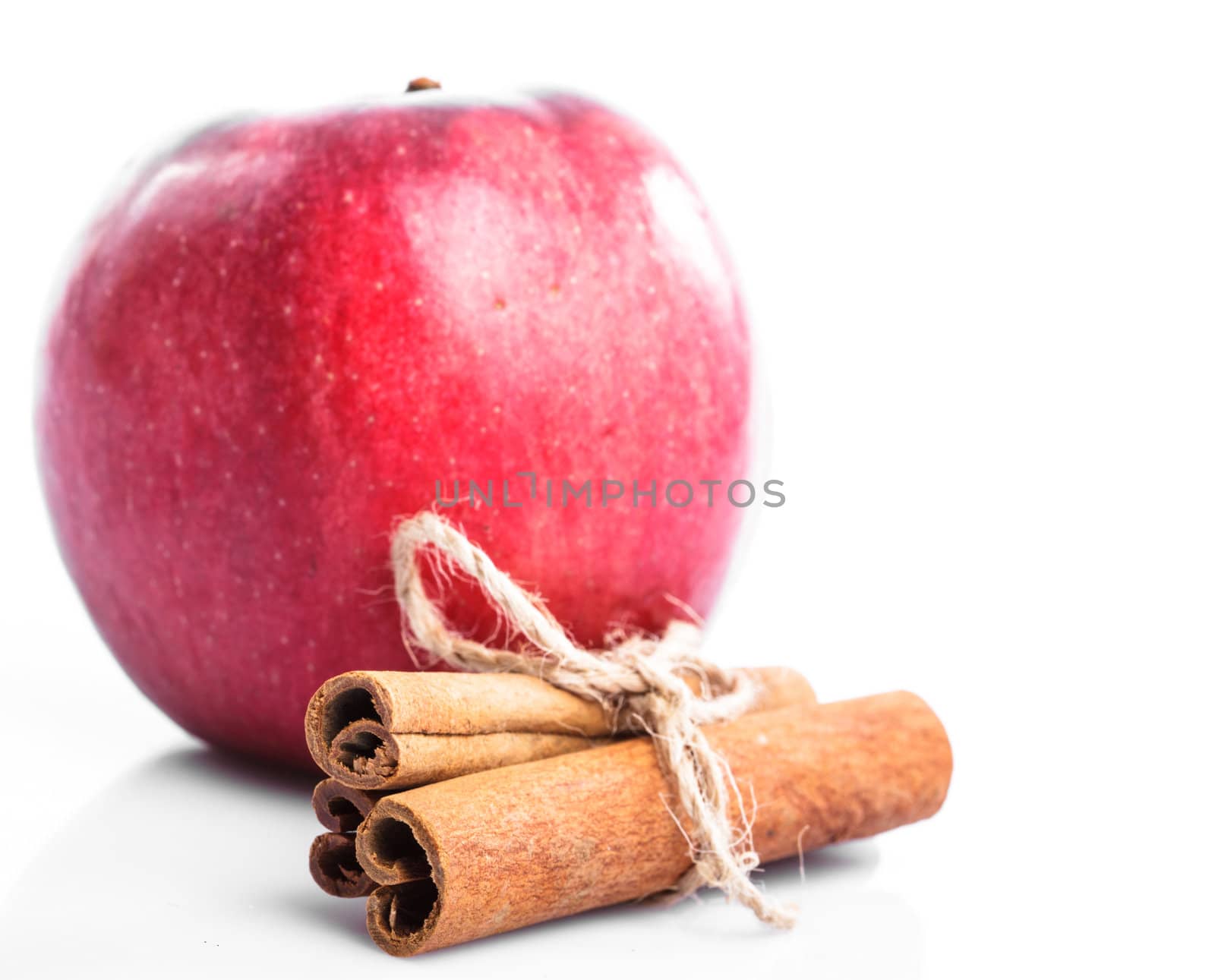 Good combination of apple and cinnamon isolated on white