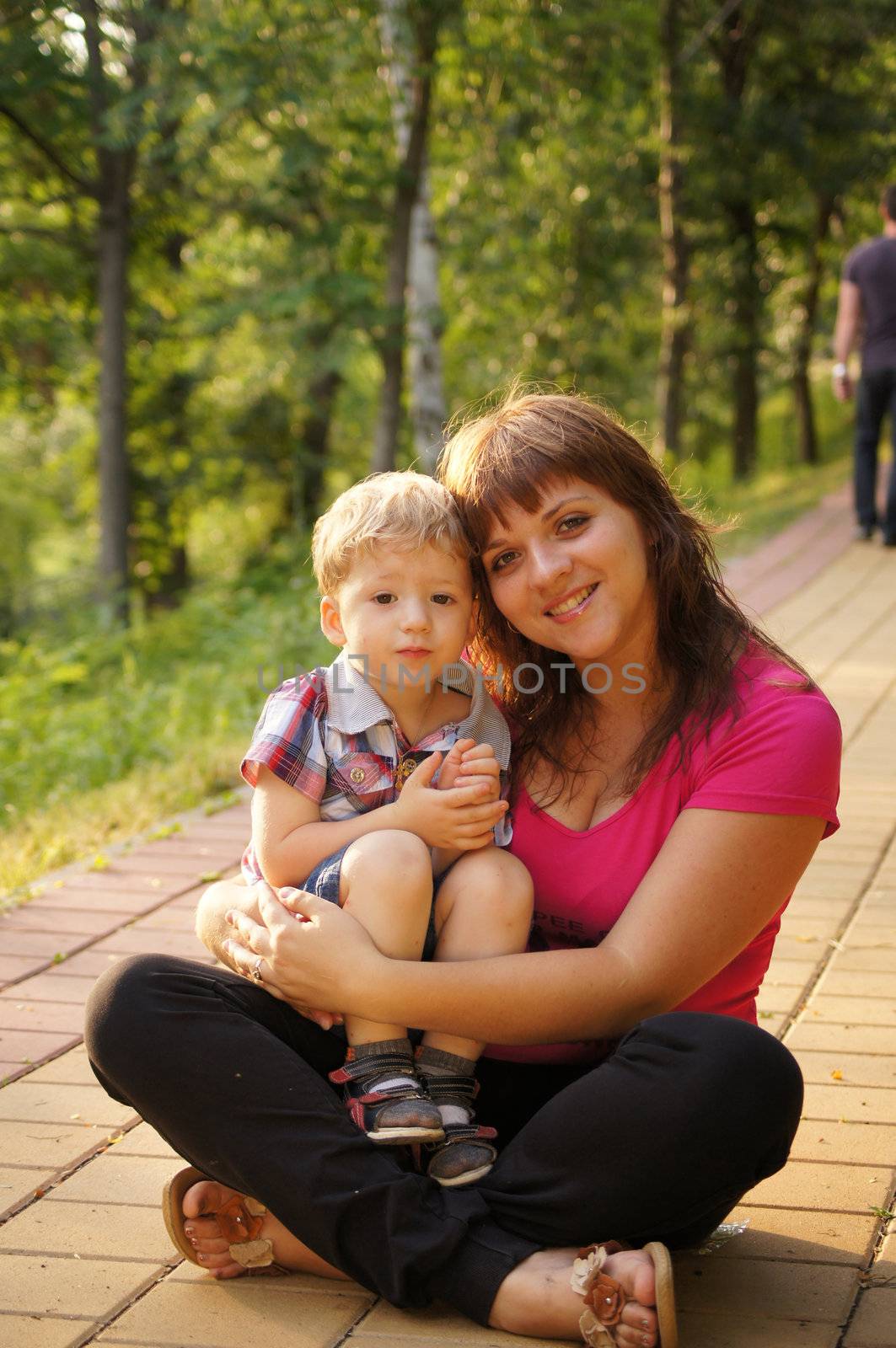 The little boy with mum on walk