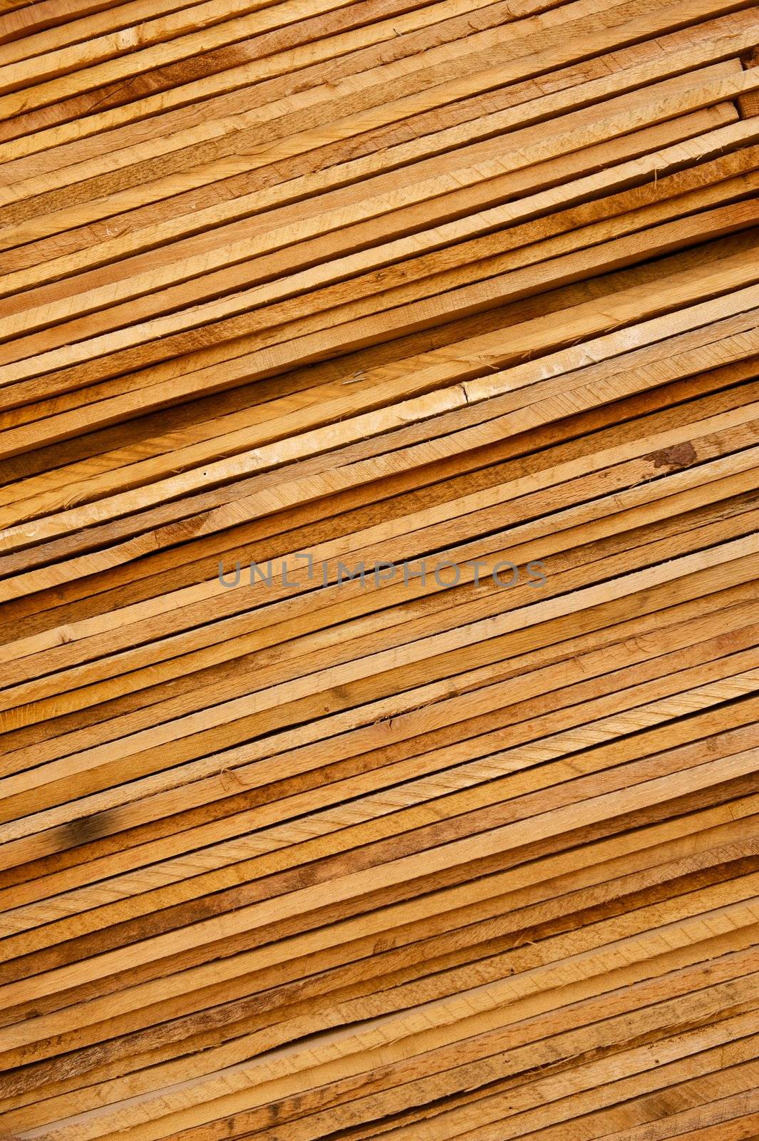 Slanted Stack of Wooden Planks Background by pixelsnap