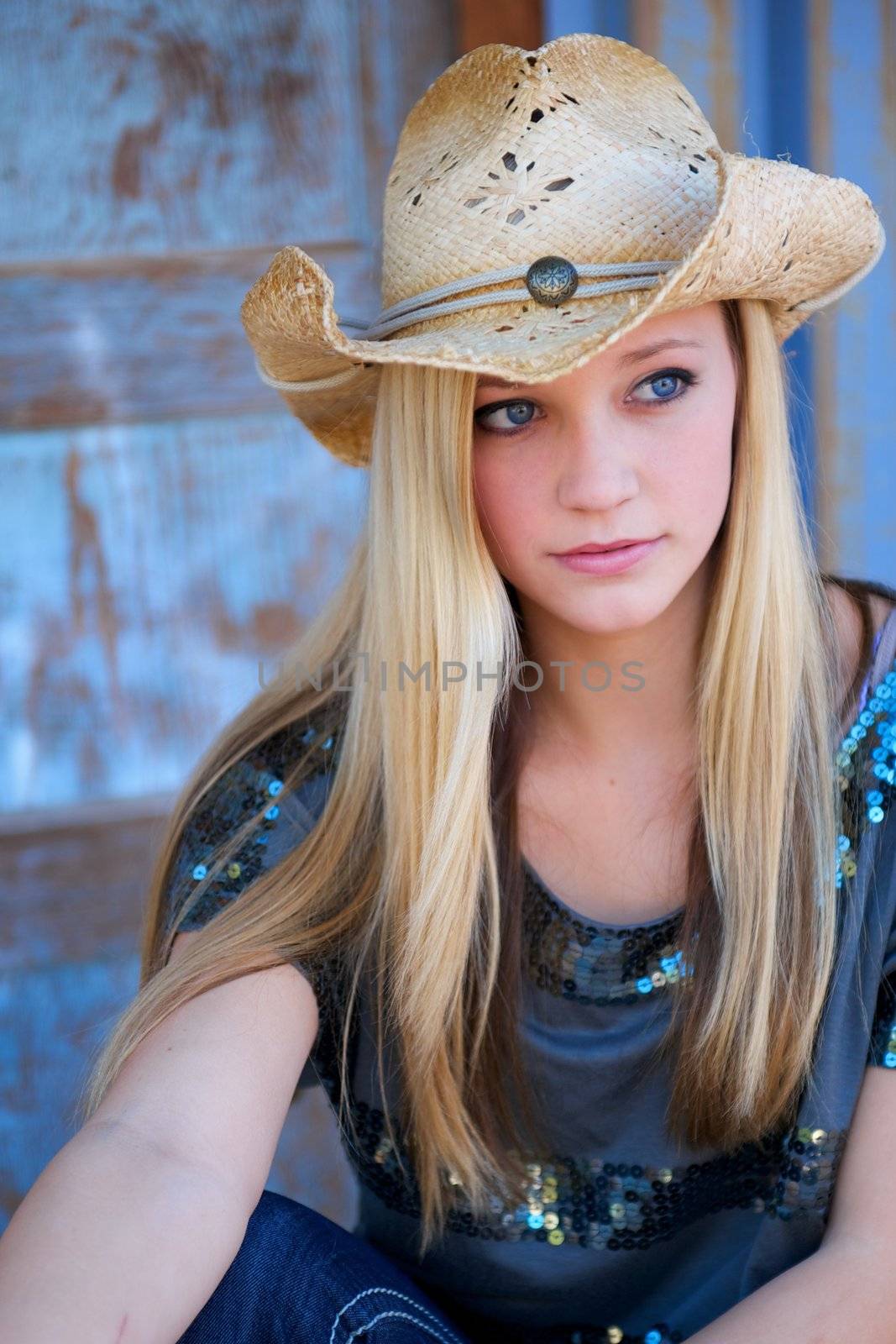 Teen Blond Model with Cowboy Hat and Blue Eyes by pixelsnap