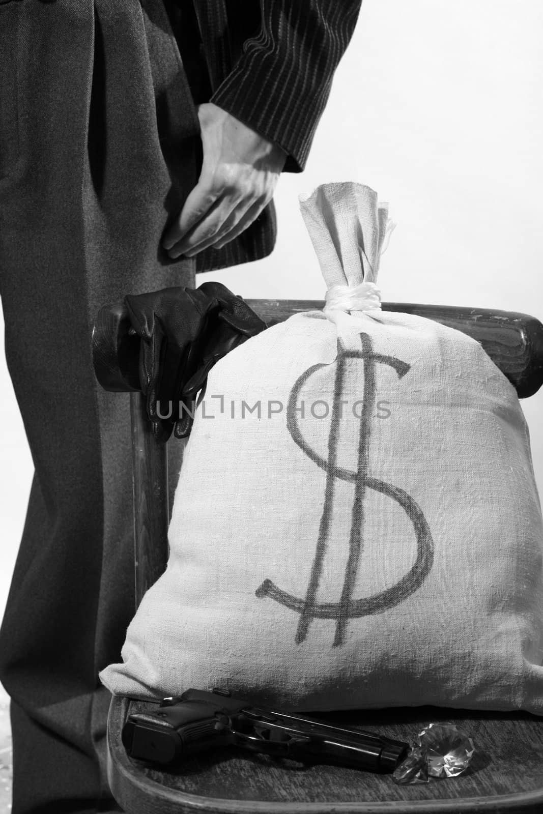 An image of a sack on a chair and man behind it
