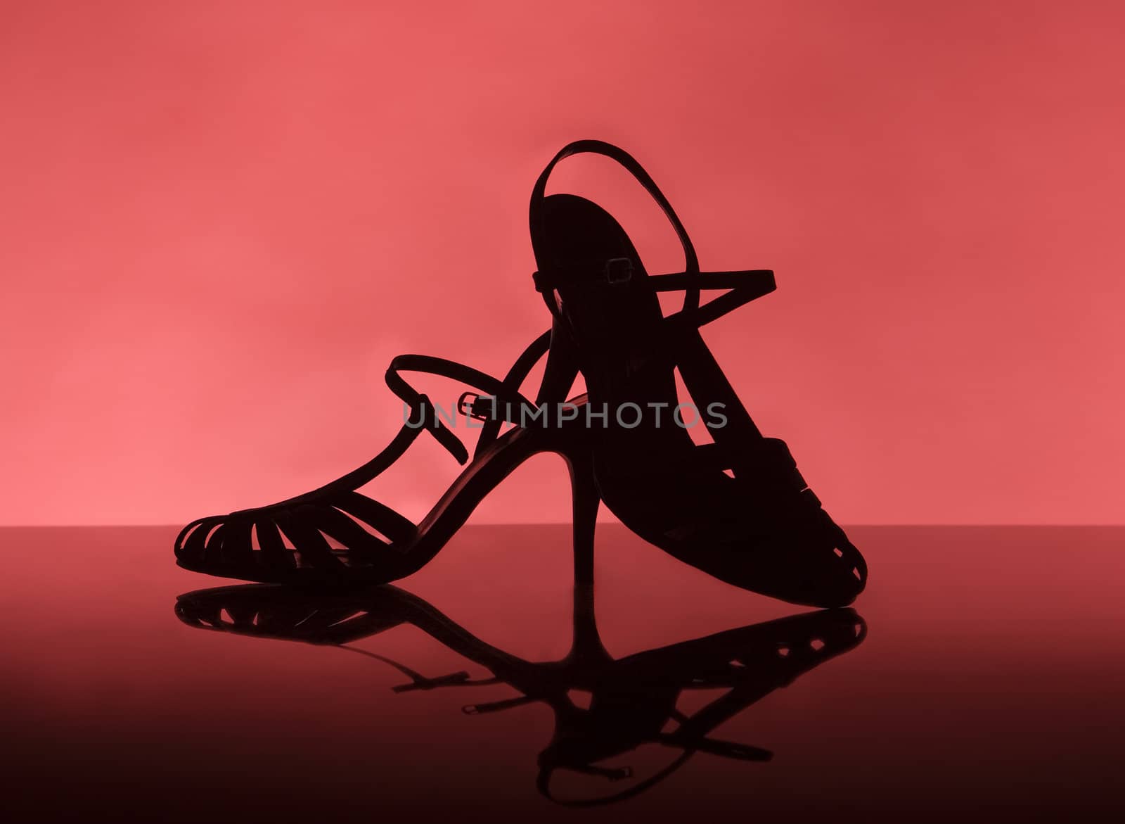 Female shoes on red background