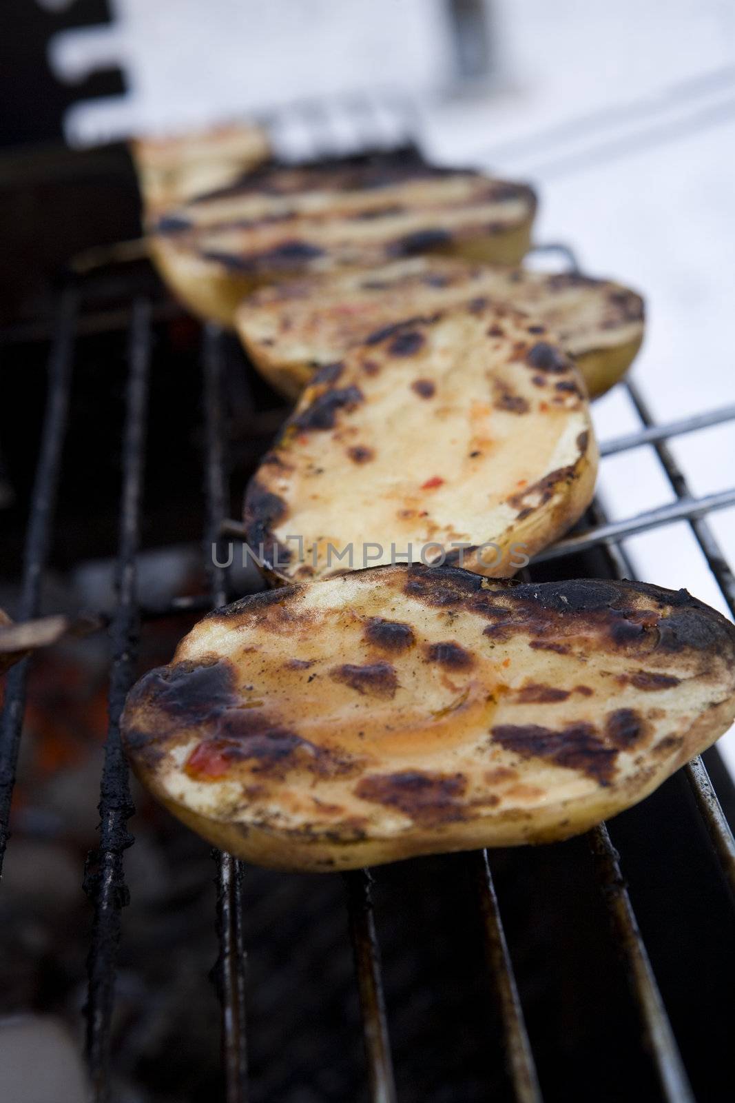 Close up of a Barbeque with potatoes