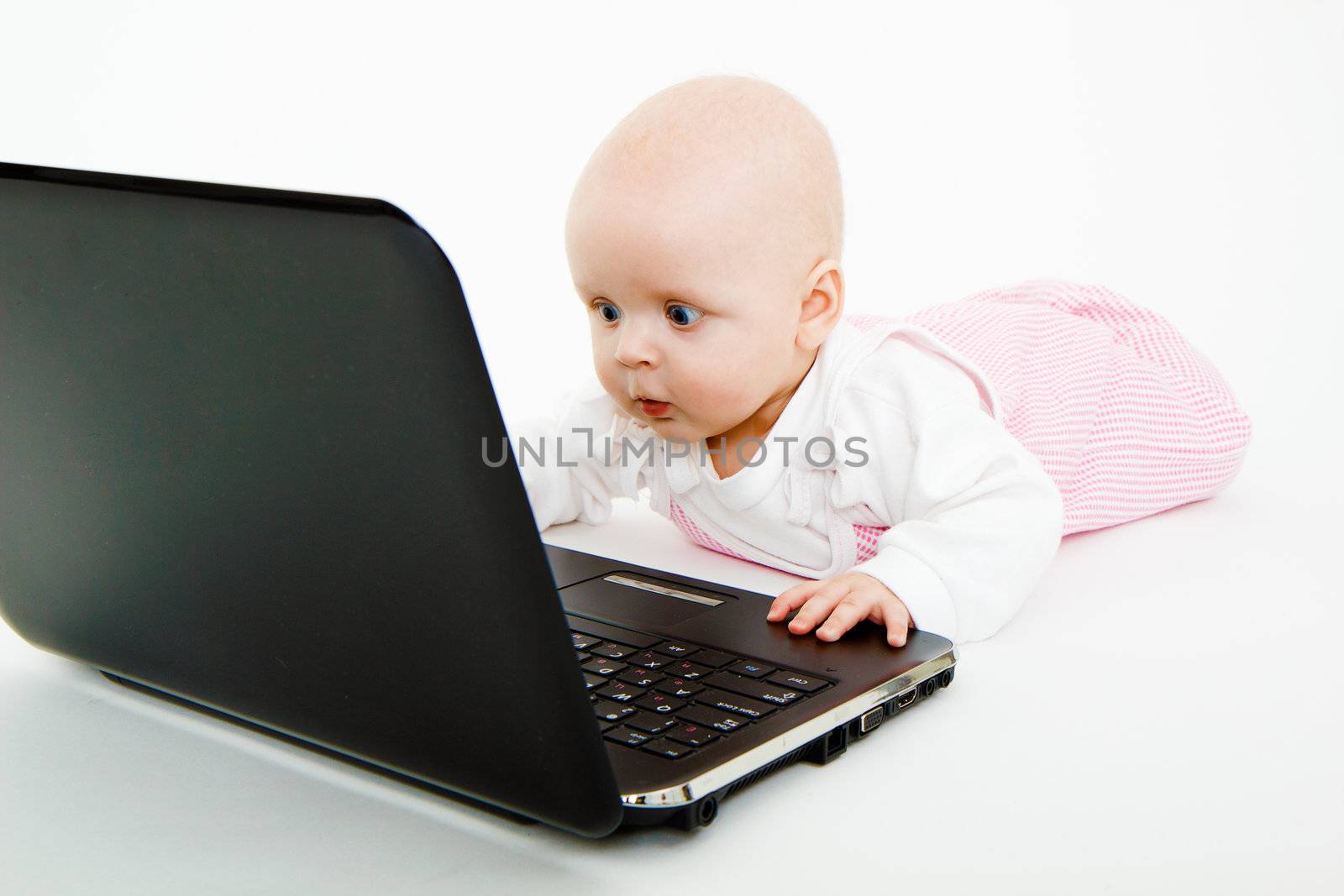 little kid in the studio with a laptop