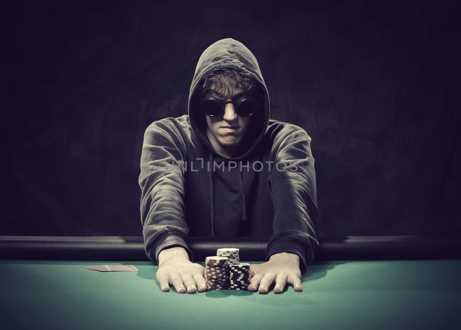 Professional poker player betting everything on one hand