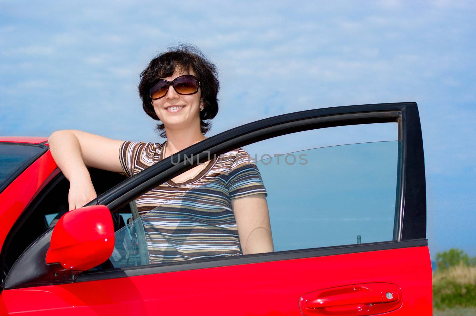 Young woman with red car by rbv