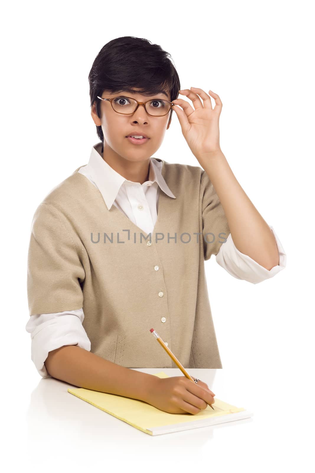 Pretty Mixed Race Young Adult Female Student at Table Isolated on White.