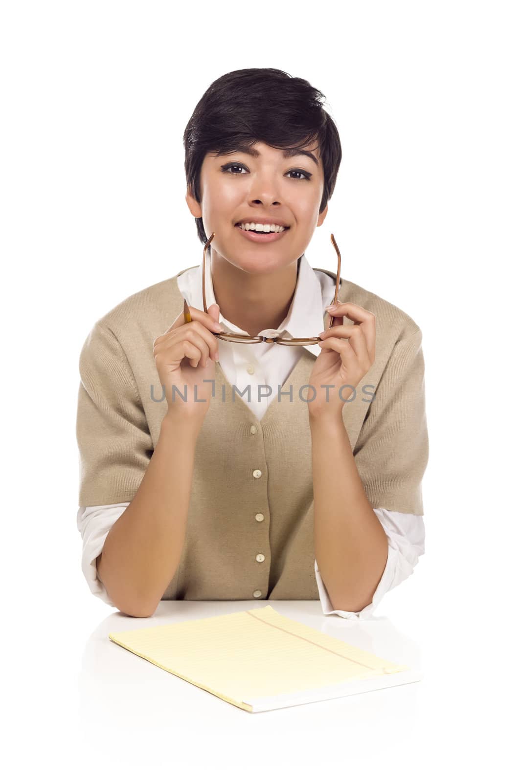 Pretty Smiling Mixed Race Female Student at Desk with Books Isolated on a White Background.