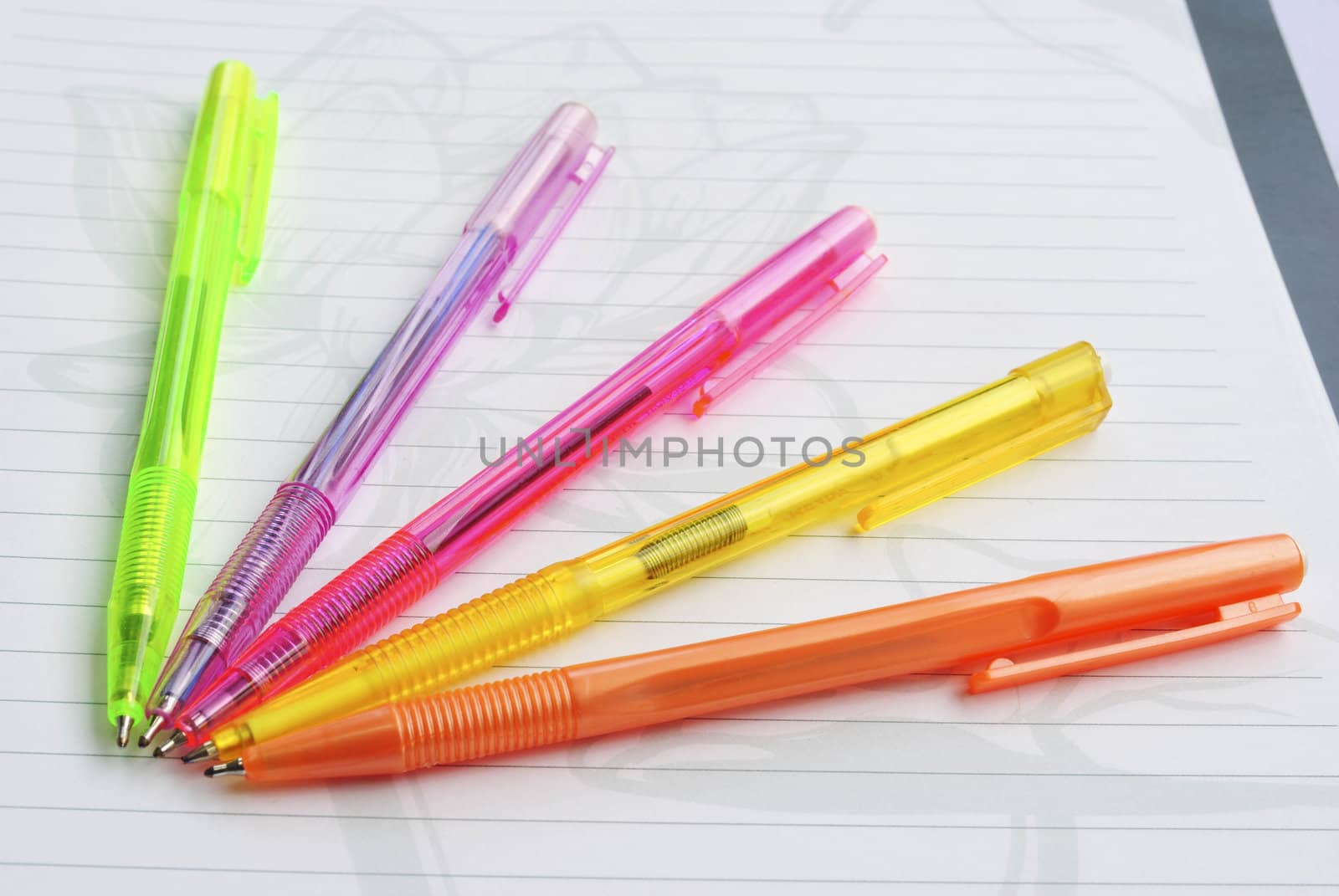 Color pens on the  writing-book