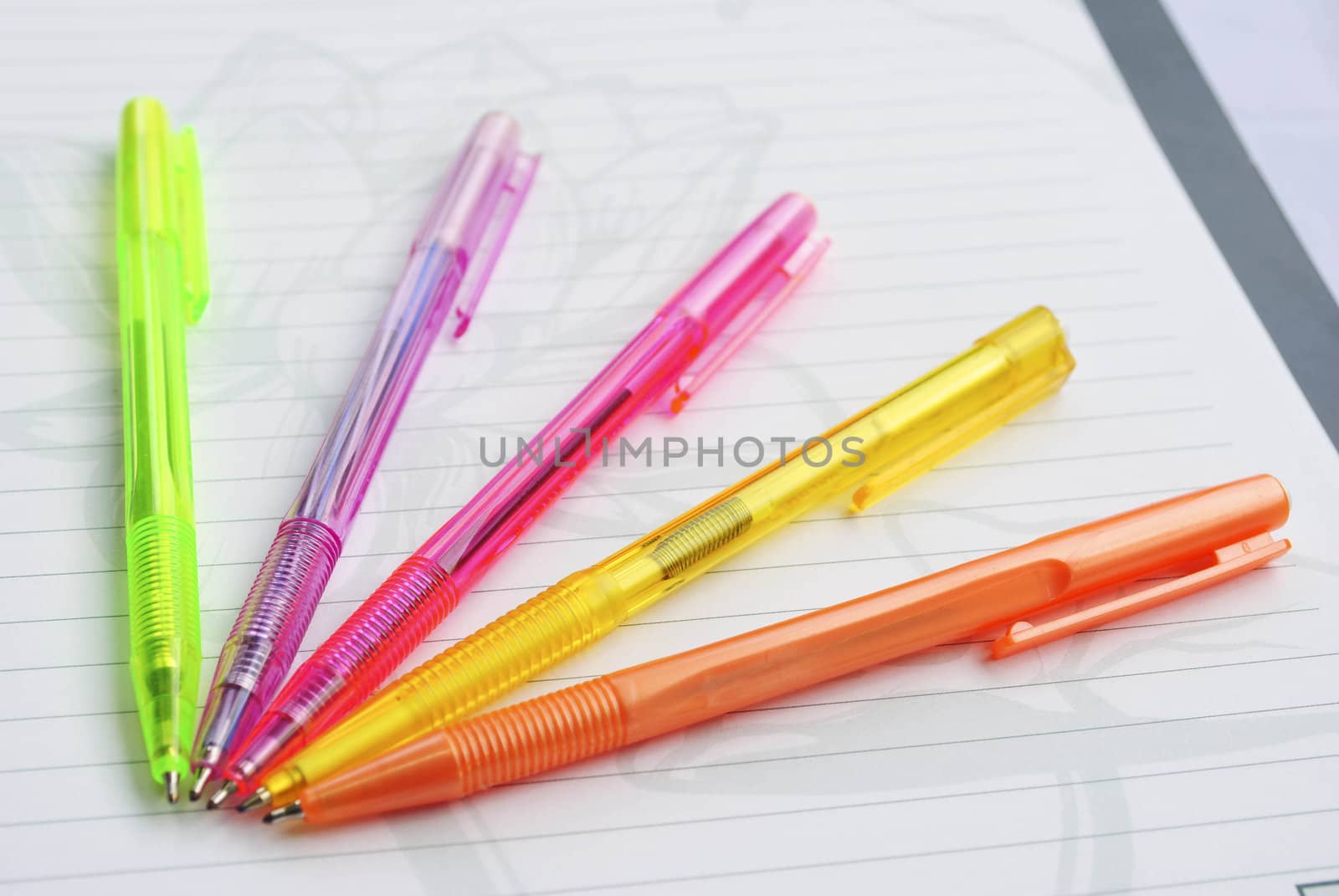 Color pens on the  writing-book