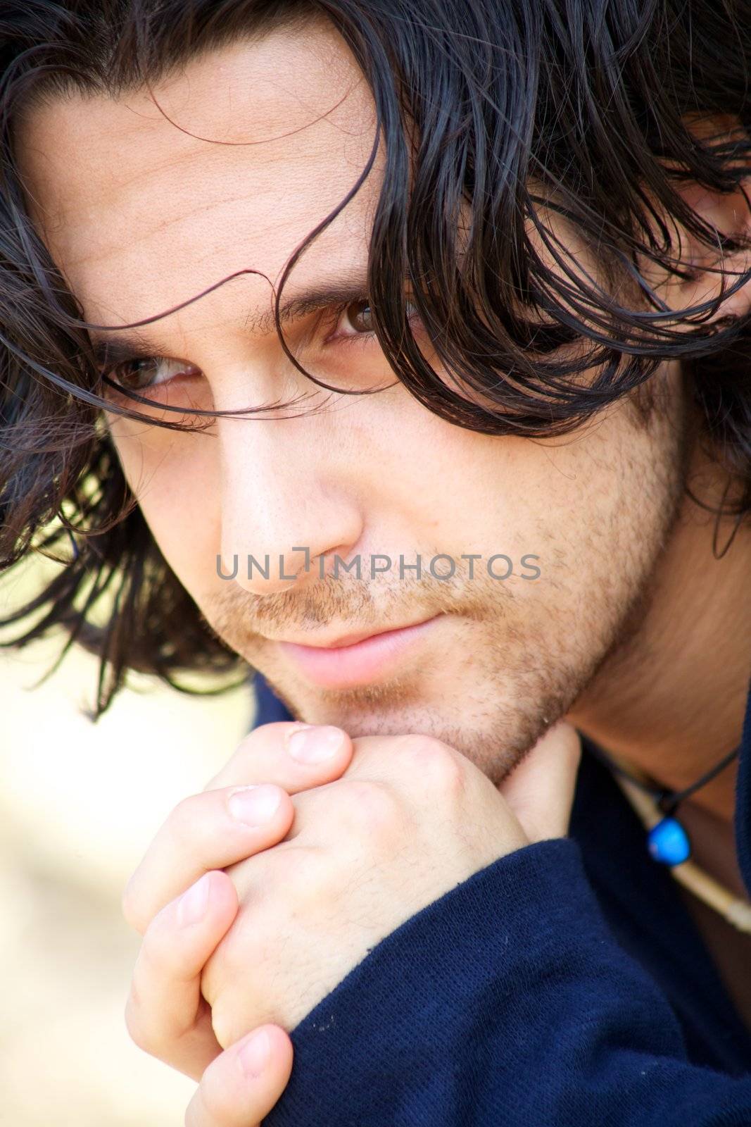 Italian male fashion model thinking and looking away
