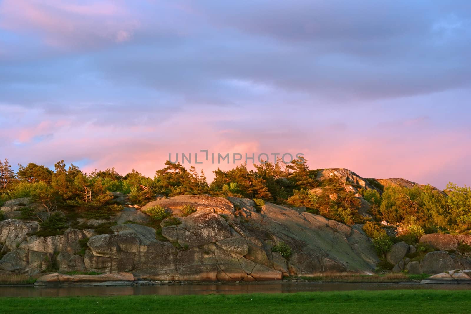 The skerry landscape in Maerrapanna lit by the evening sun in Southern Norway close to Vikene