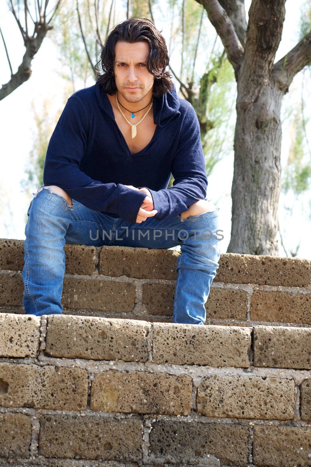 Muscular male model on stairs with sweat shirt by fmarsicano