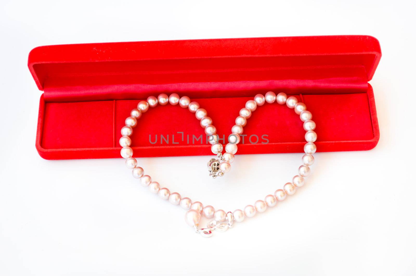 pearl in heart shape on white background