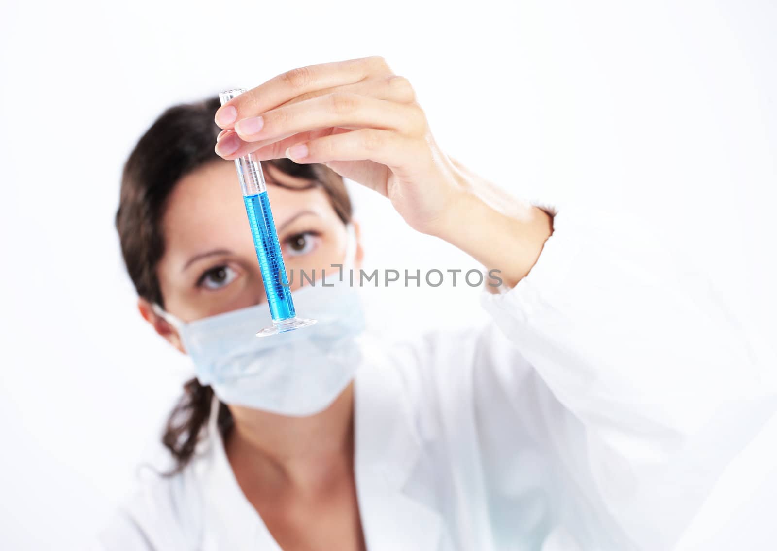 a young woman researcher working with chemicals