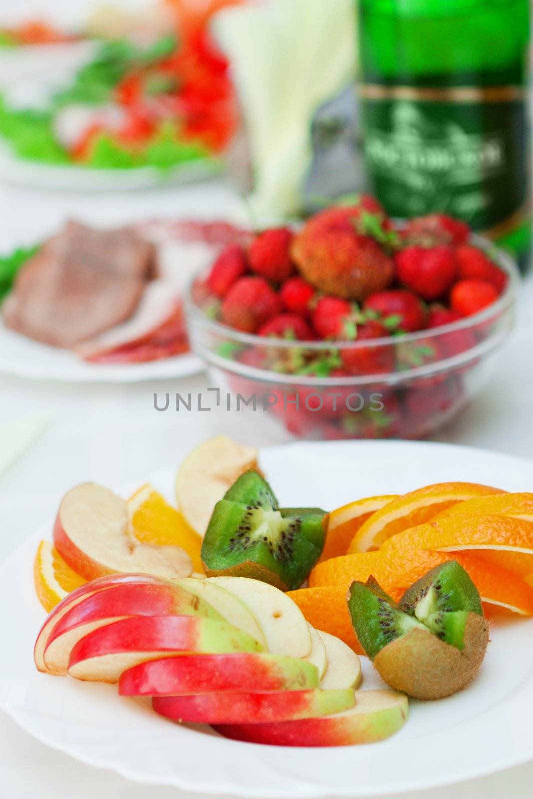 cutting of fruit on a light background with other ingredients.