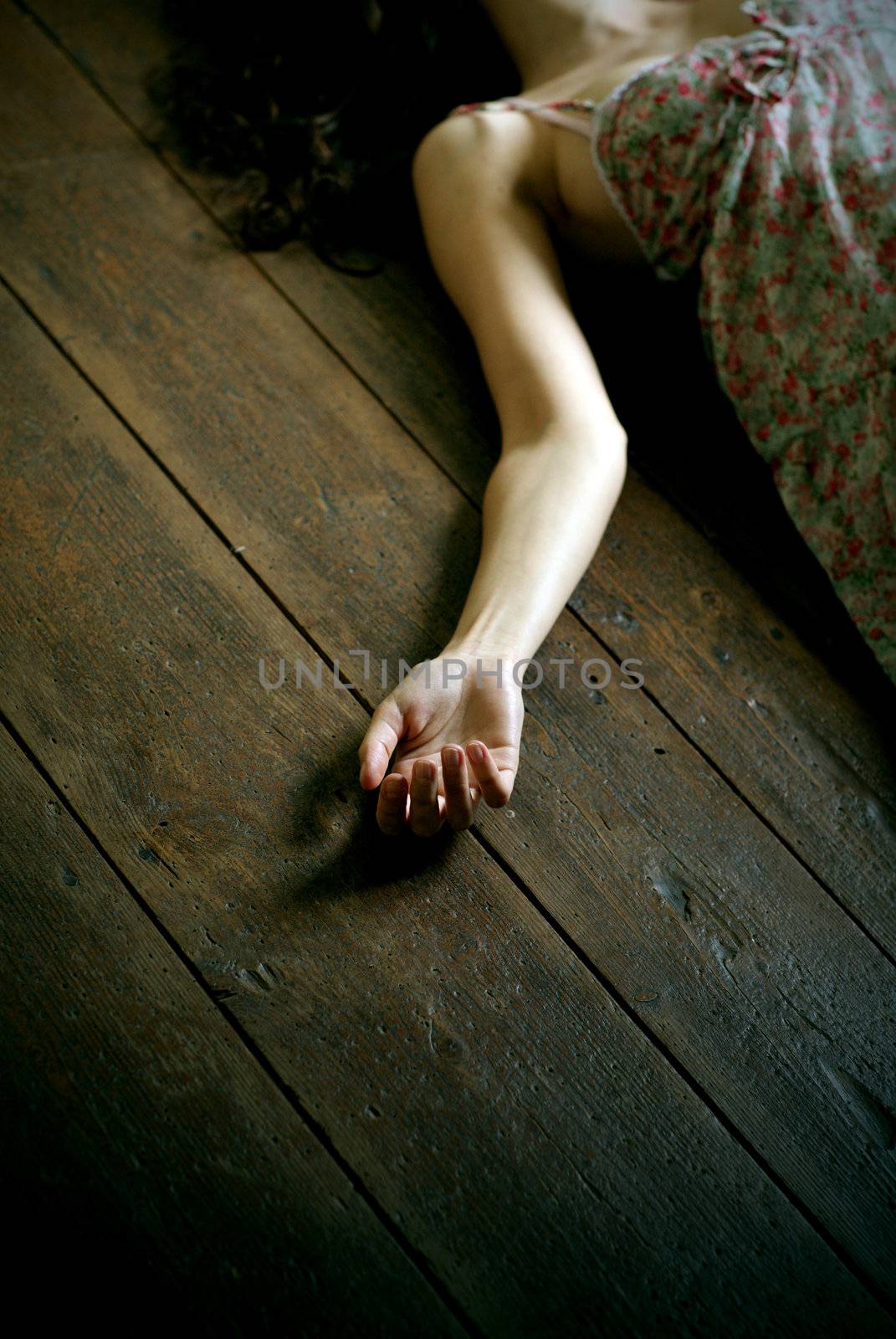 dead woman lying on the floor, focus on the hand
