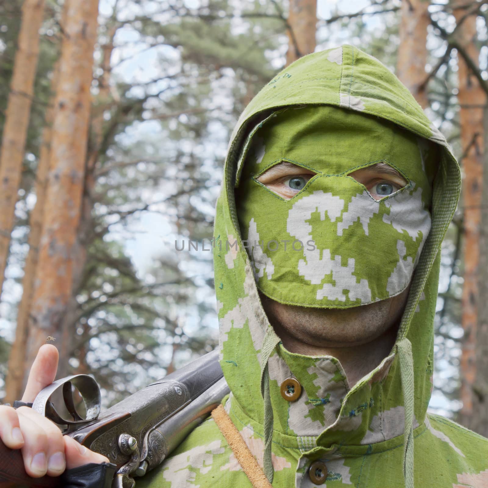 Look of a man in a camouflage mask