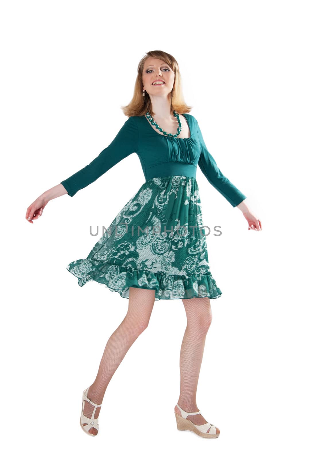 beautiful woman in a green dress and beads isolated on white background