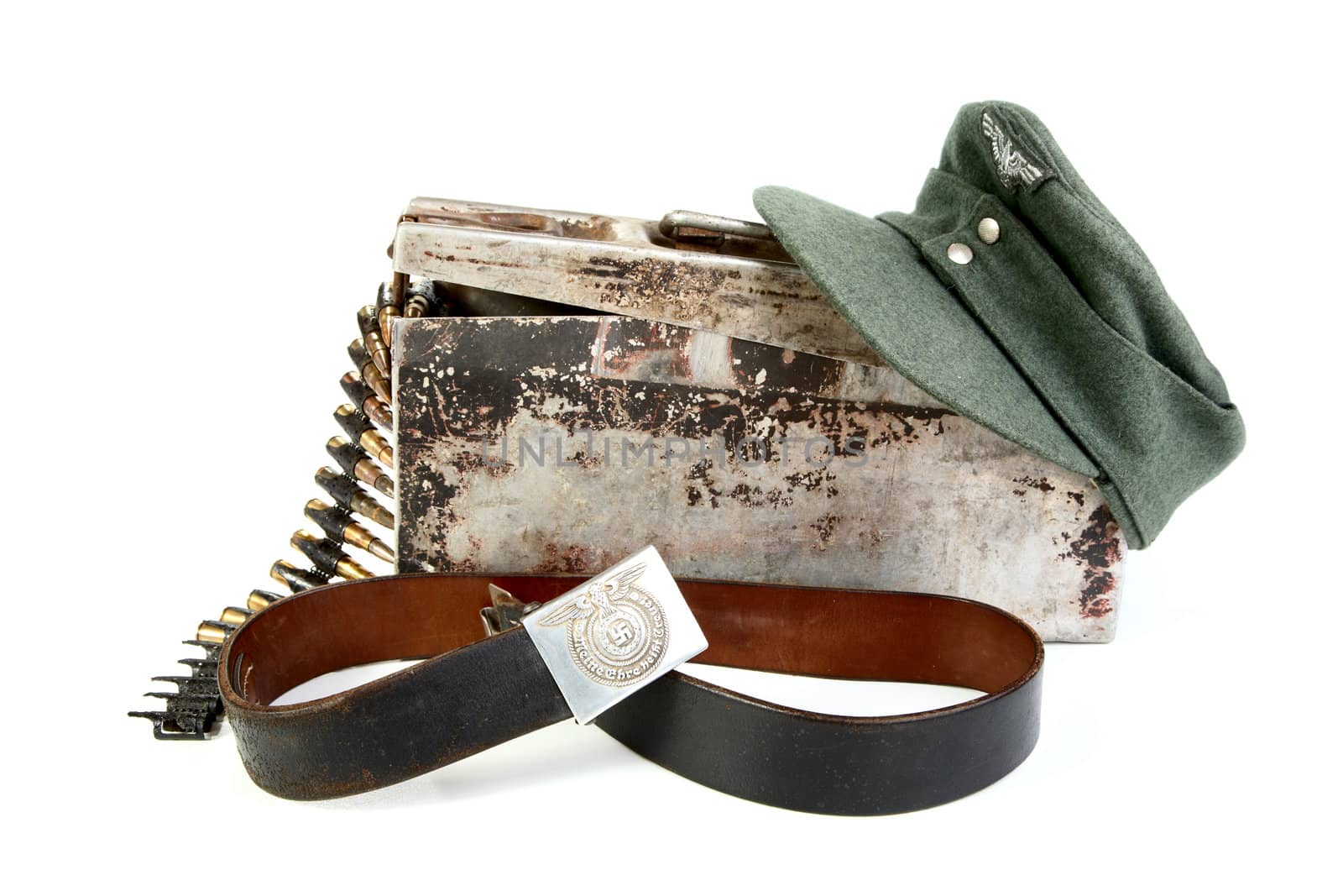 Machine-gun tape in  box of  kepi and  belt  German soldier on a white background