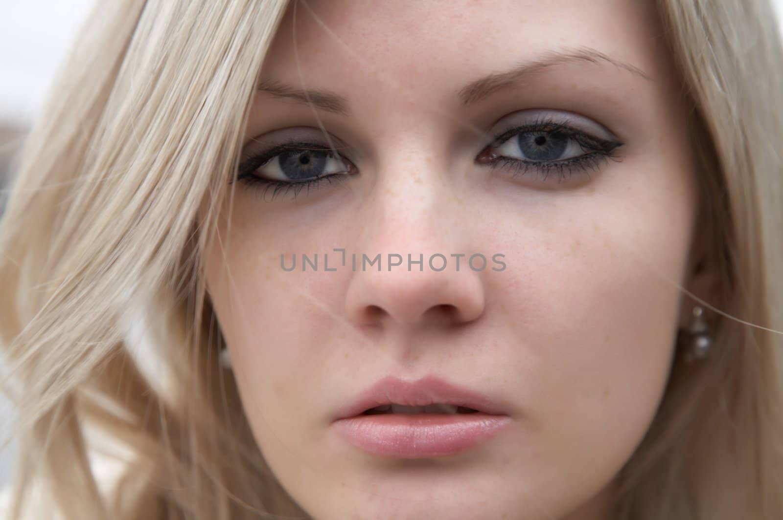 Portrait of the beautiful girl with light hair close up